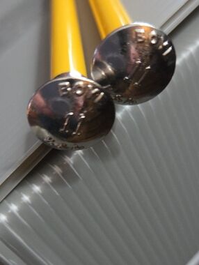 The image shows a pair of vintage Boye knitting needles Sz 11